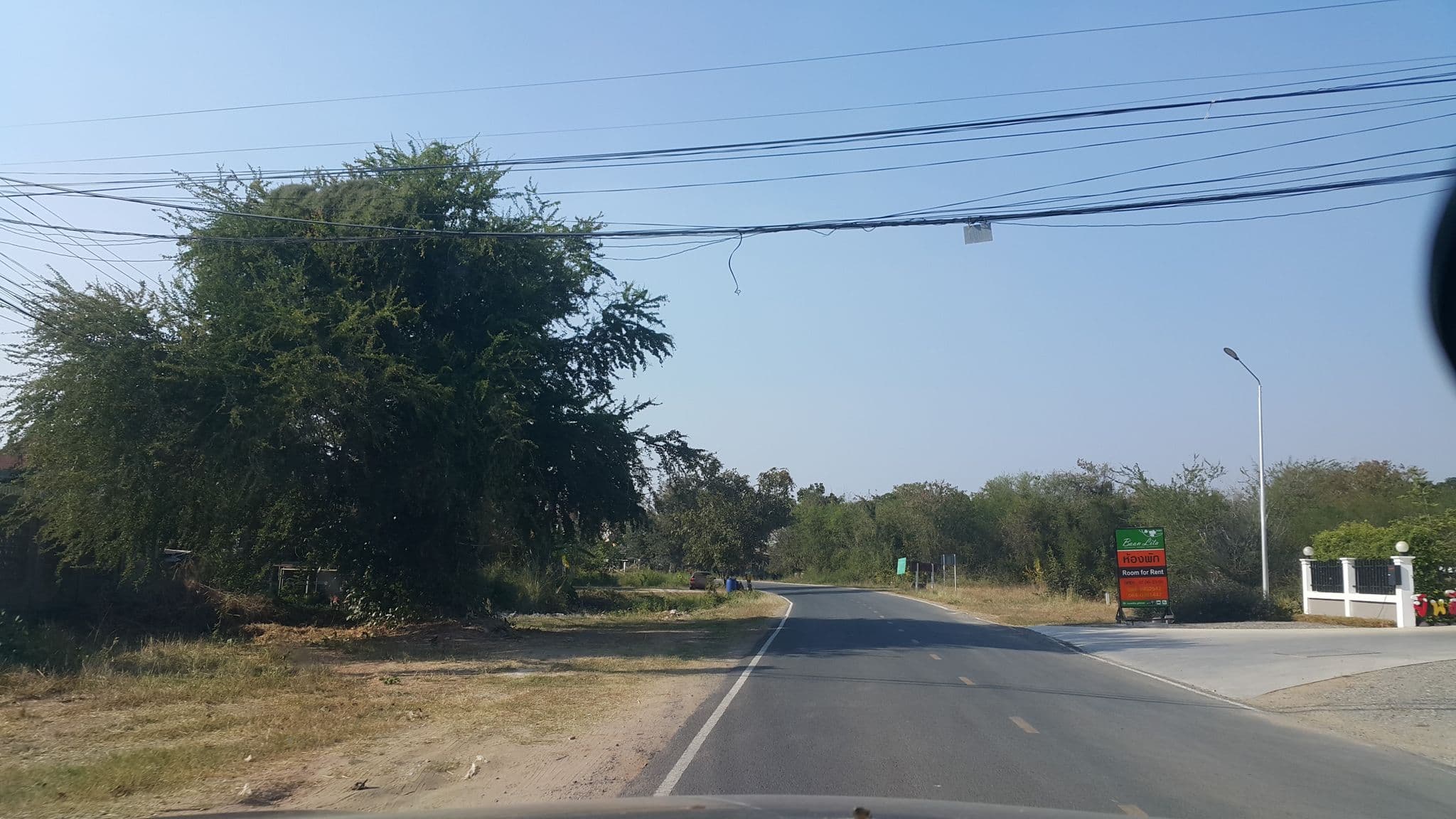 Street view near บ้านลิตา (Baan Lita) @ พิมาย, Phimai — © jrcarlsen (CC BY-SA · Mapillary)