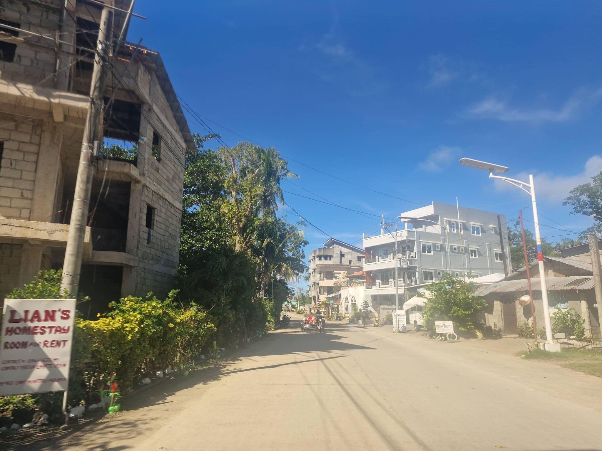 Street view near Carlo's Homestay, Pagudpud — © Yivan000 (CC BY-SA · Mapillary)