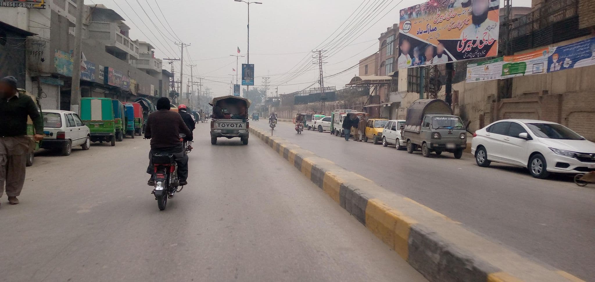 Street view near Al Falah Hotel, Peshawar — © RobinGoix (CC BY-SA · Mapillary)