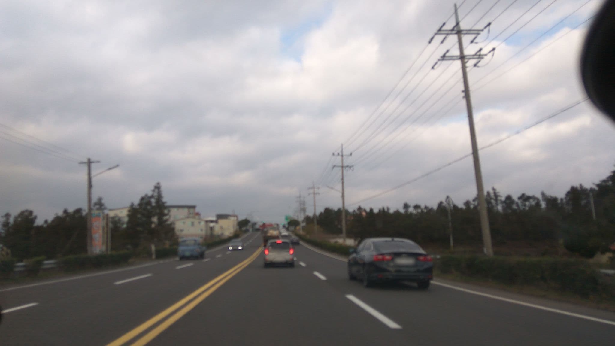 Street view near 칸델라팬션, Seogwipo — © eneerhut (CC BY-SA · Mapillary)