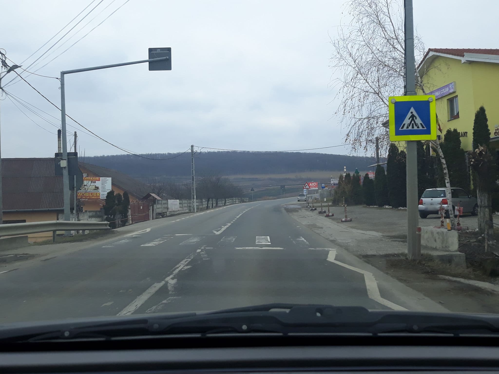 Street view near Pensiunea Colina, Crişeni — © murmidon (CC BY-SA · Mapillary)