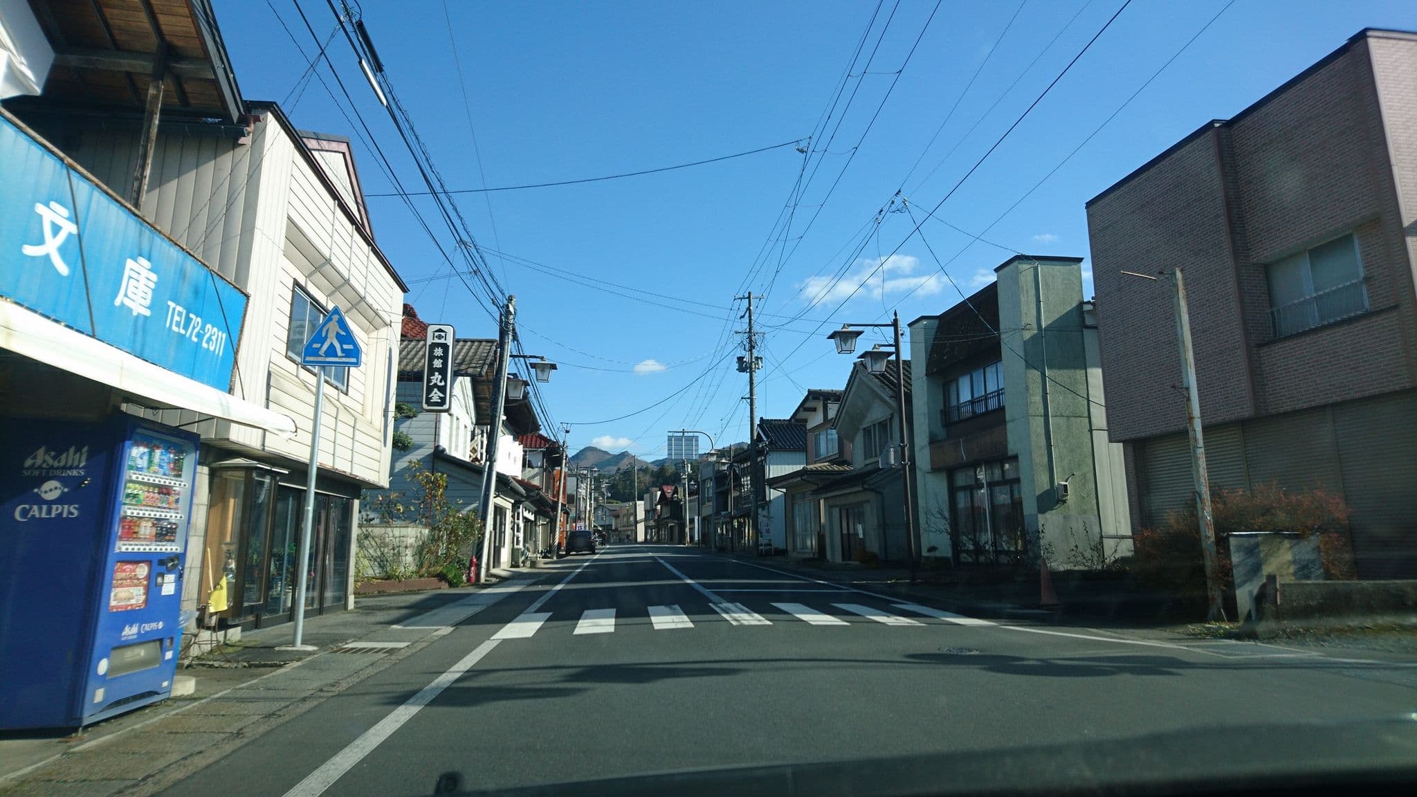 Street view near 丸全旅館, Kesennuma — © tanakayamada (CC BY-SA · Mapillary)