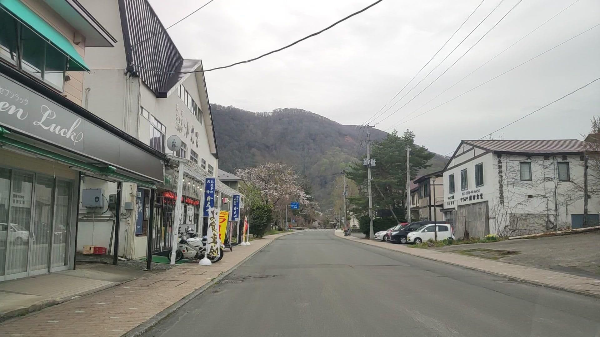 Street view near 十和田湖畔 桜楽, Kosaka — © drivephotograph (CC BY-SA · Mapillary)
