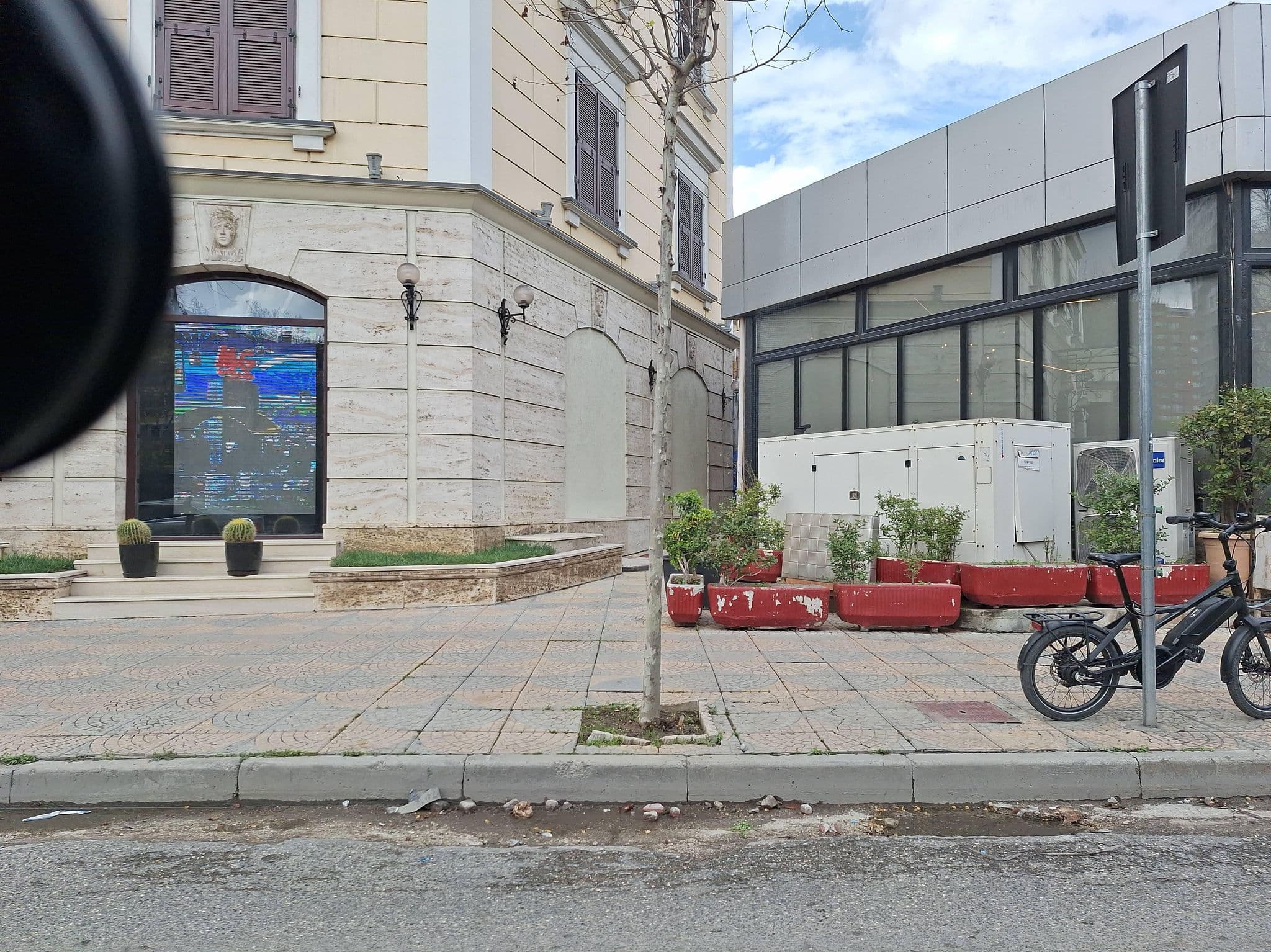 Street view near Hotel Monarch, Tirana — © denisju_osm (CC BY-SA · Mapillary)