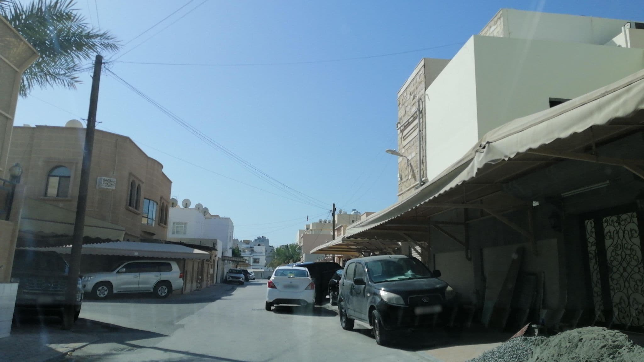 Street view near Pars International Hotel, Al Ḩadd — © sherif1234 (CC BY-SA · Mapillary)