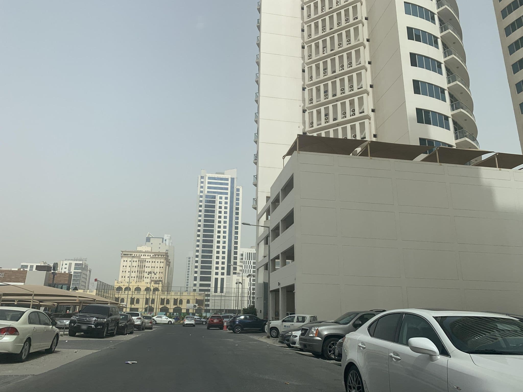 Street view near Toulib Hotel In Manama AlBahrin, Sanābis — © sherif1234 (CC BY-SA · Mapillary)