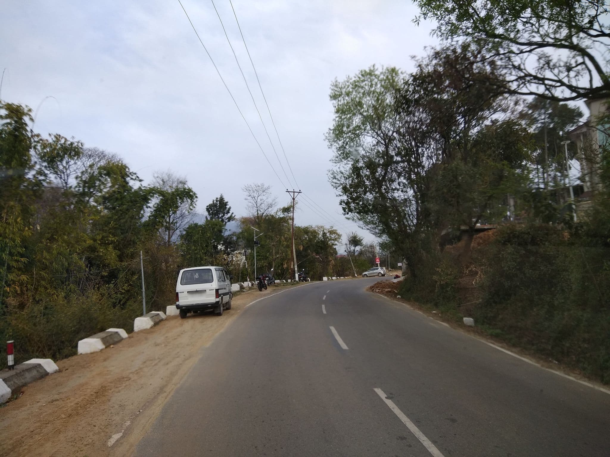 Street view near jüSTa Palampur Resort & Convention Centre, Pālampur — © bholekibhasam (CC BY-SA · Mapillary)