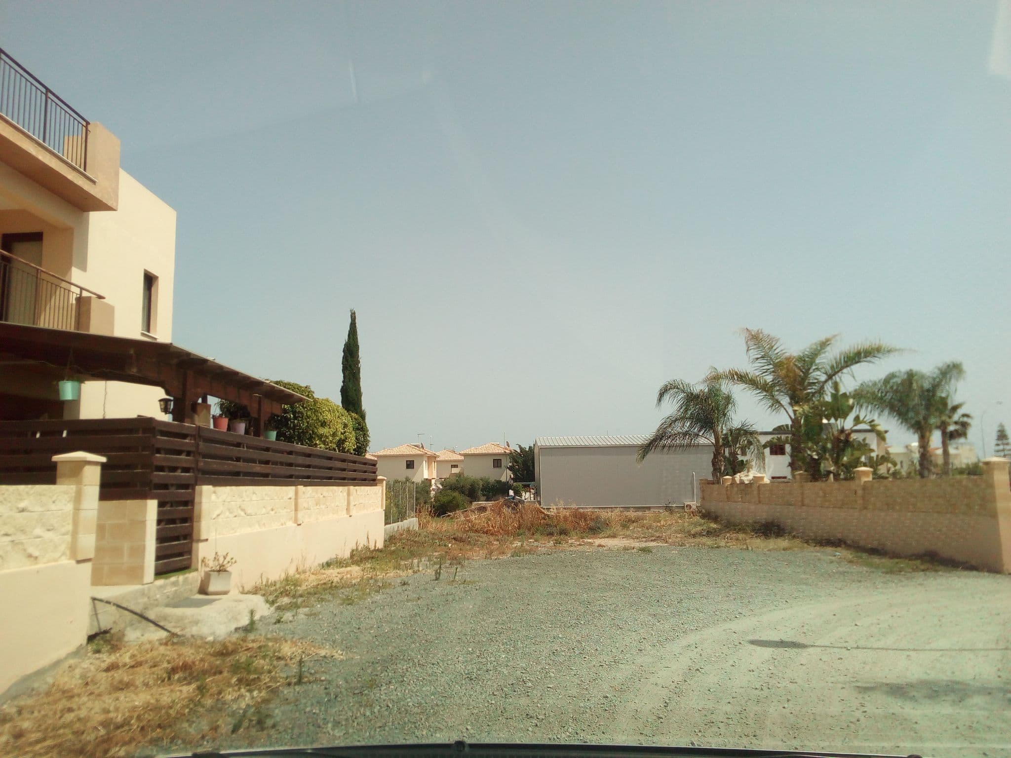 Street view near The Olympians Apartments, Perivólia — © stpkyriakou (CC BY-SA · Mapillary)