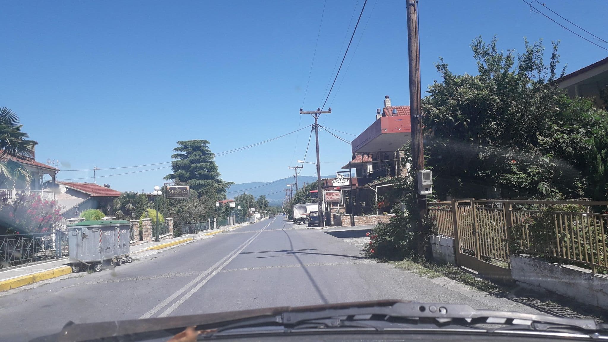 Street view near Ξενώνας Μορφέας (Morfeas Guesthouse), Polykárpi — © jte (CC BY-SA · Mapillary)