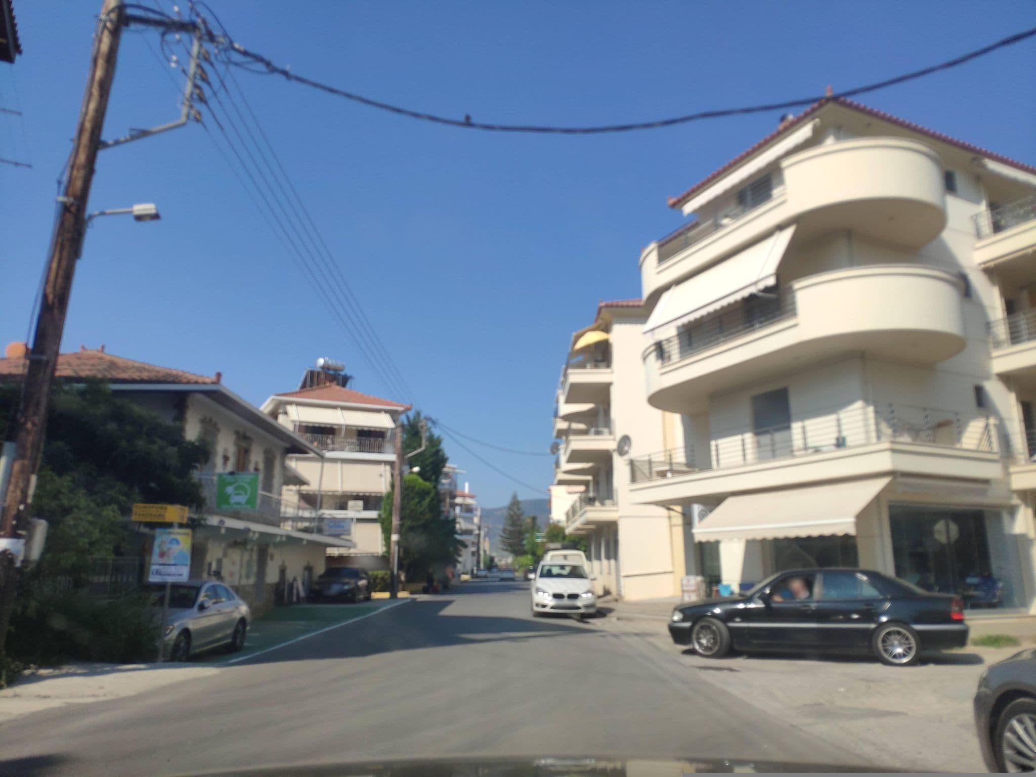 Street view near Studios Maria's, Parálio Ástros — © pppetros (CC BY-SA · Mapillary)