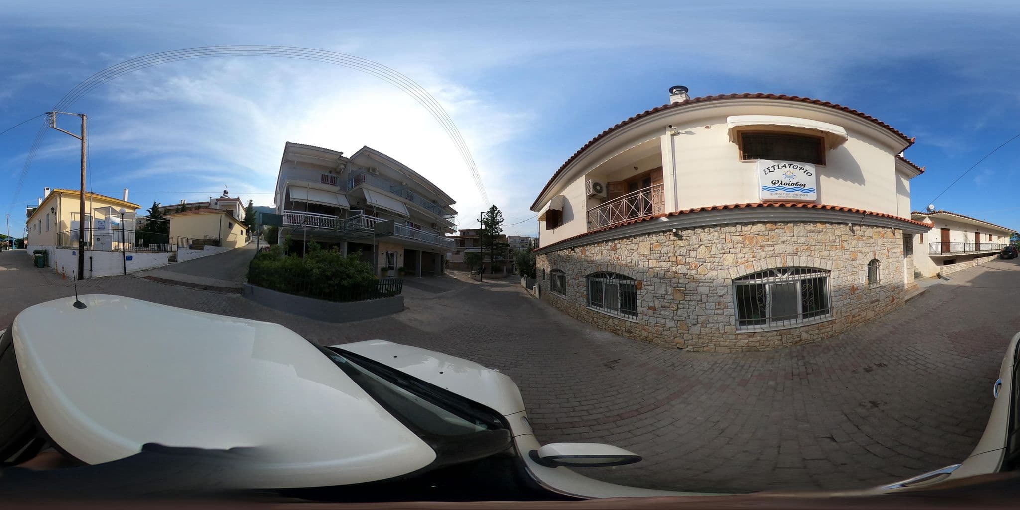 Street view near Fotopoulos Apartments, Parálio Ástros — © efikour (CC BY-SA · Mapillary)