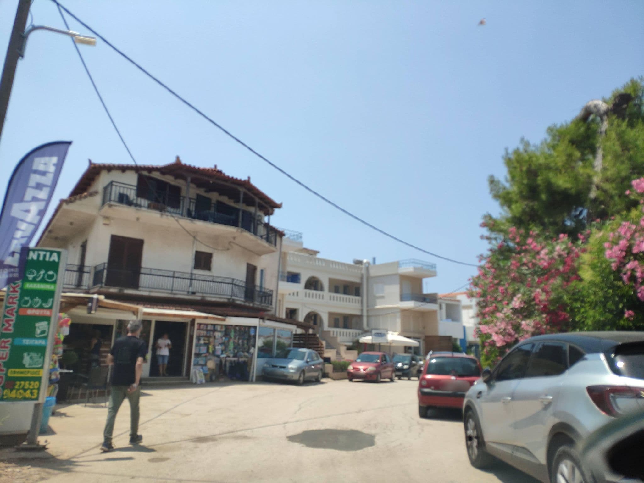 Street view near Dimitra Apartments, Drépanon — © pppetros (CC BY-SA · Mapillary)