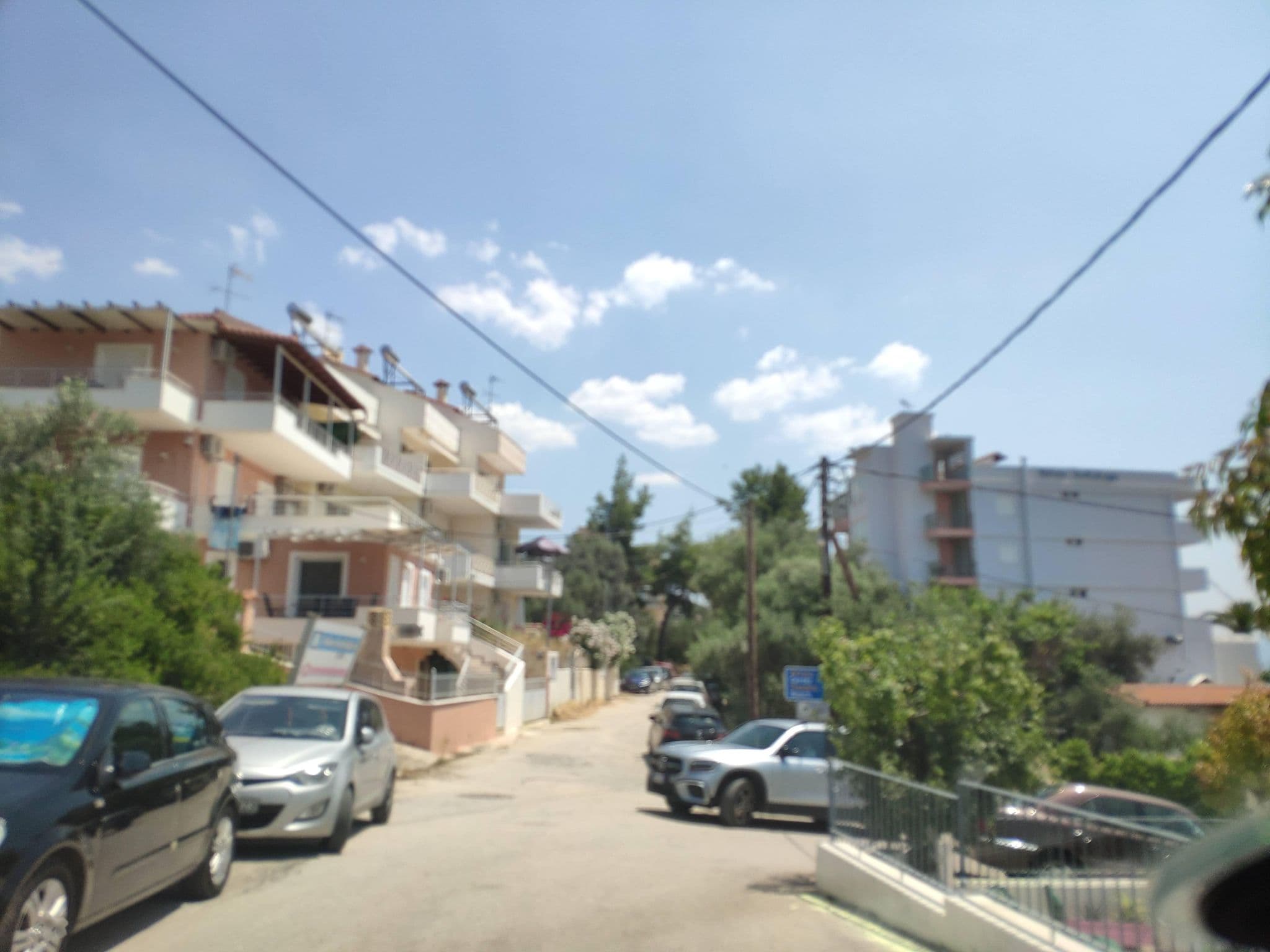 Street view near Blue Sky Studio Apartments, Tolón — © pppetros (CC BY-SA · Mapillary)
