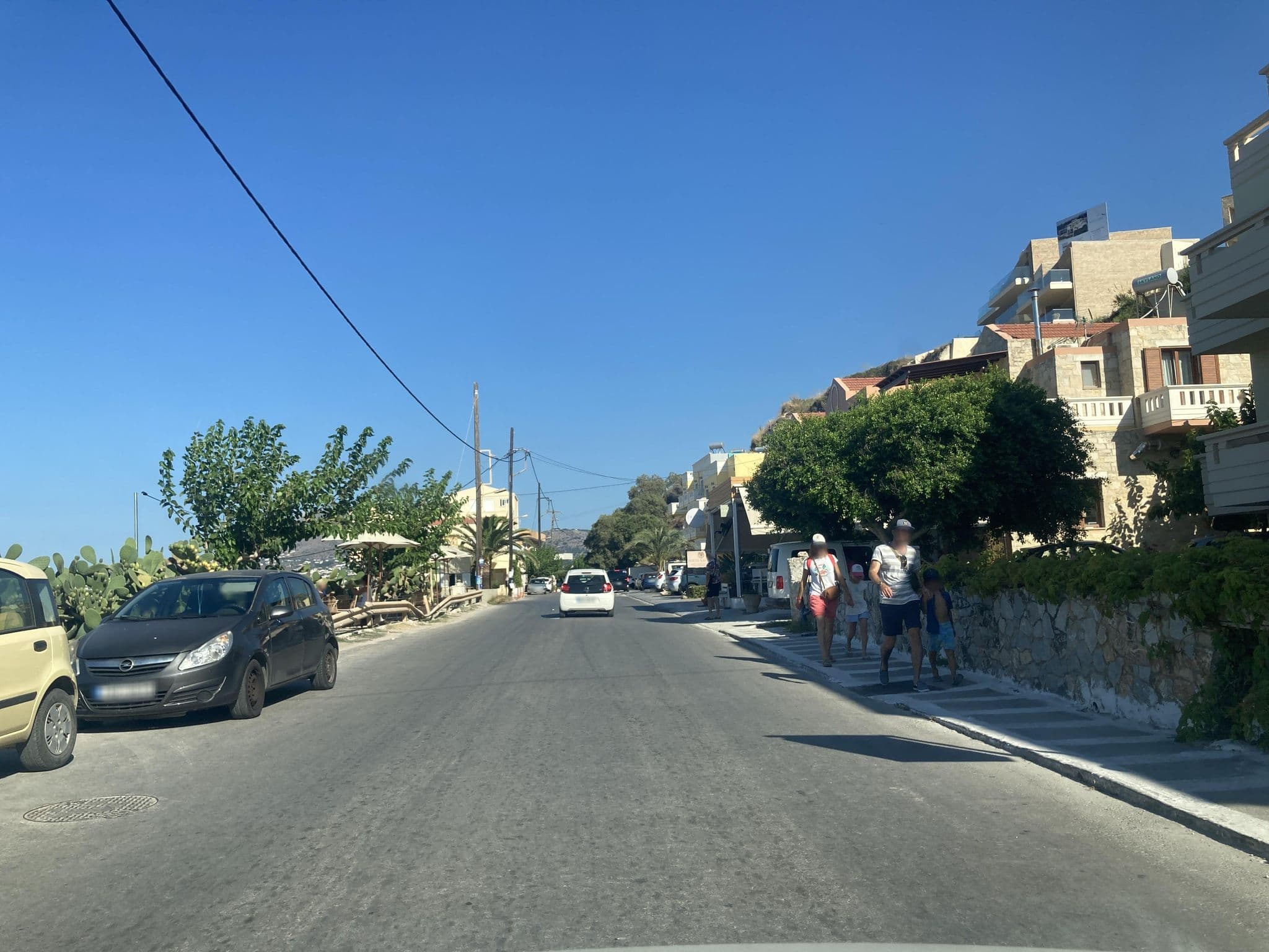 Street view near Porto Kalyves Seaside apartments, Kalýves — © fod (CC BY-SA · Mapillary)