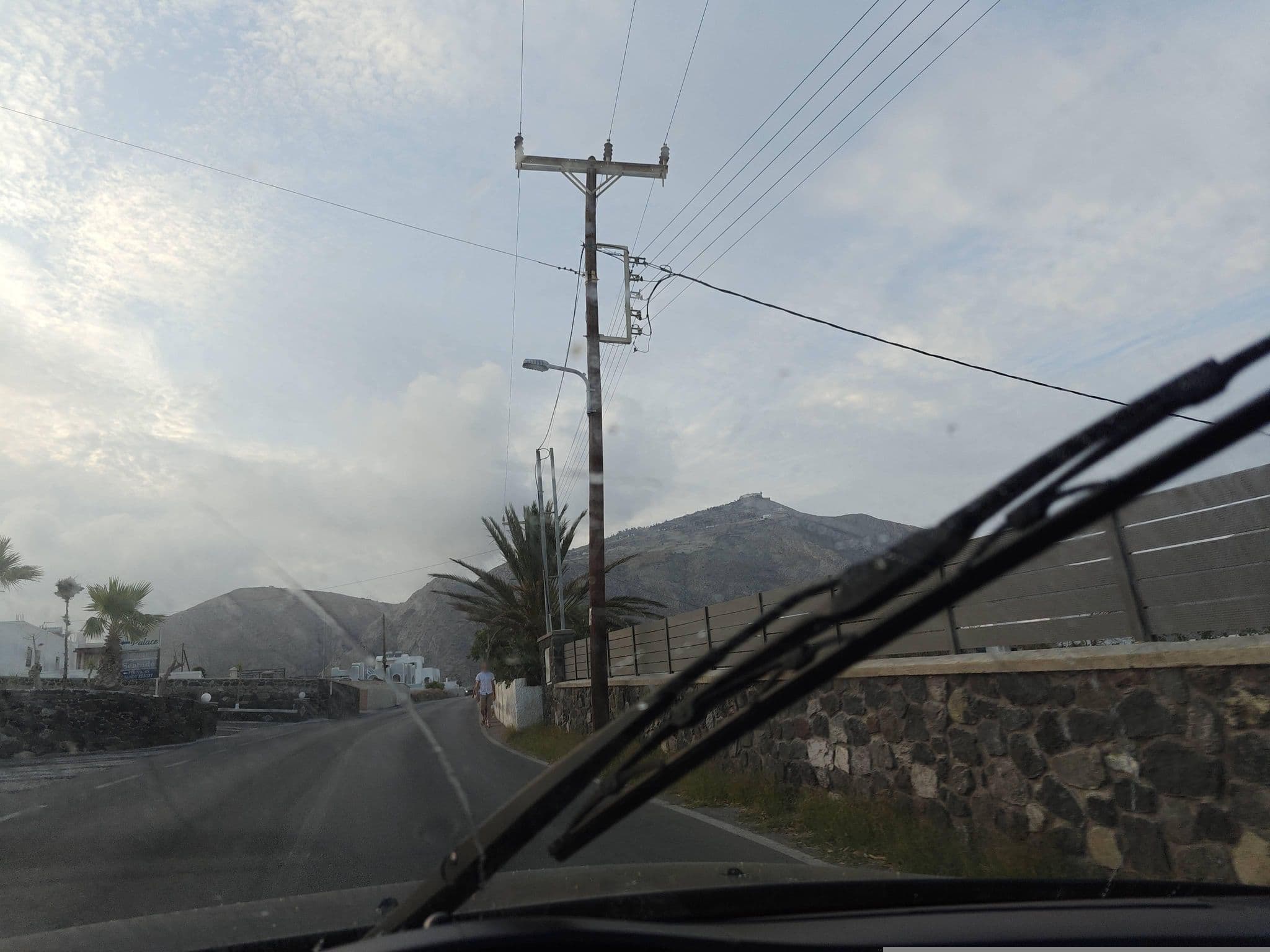 Street view near Robertos Villas Perivolos, Emporeío — © grkpete (CC BY-SA · Mapillary)