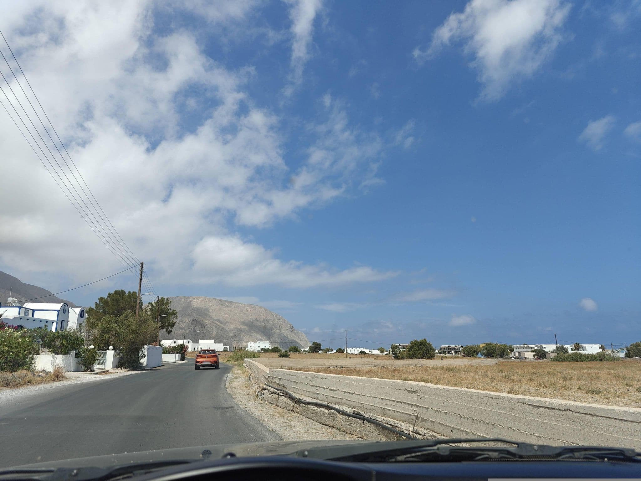 Street view near Honeymoon Beach, Emporeío — © grkpete (CC BY-SA · Mapillary)