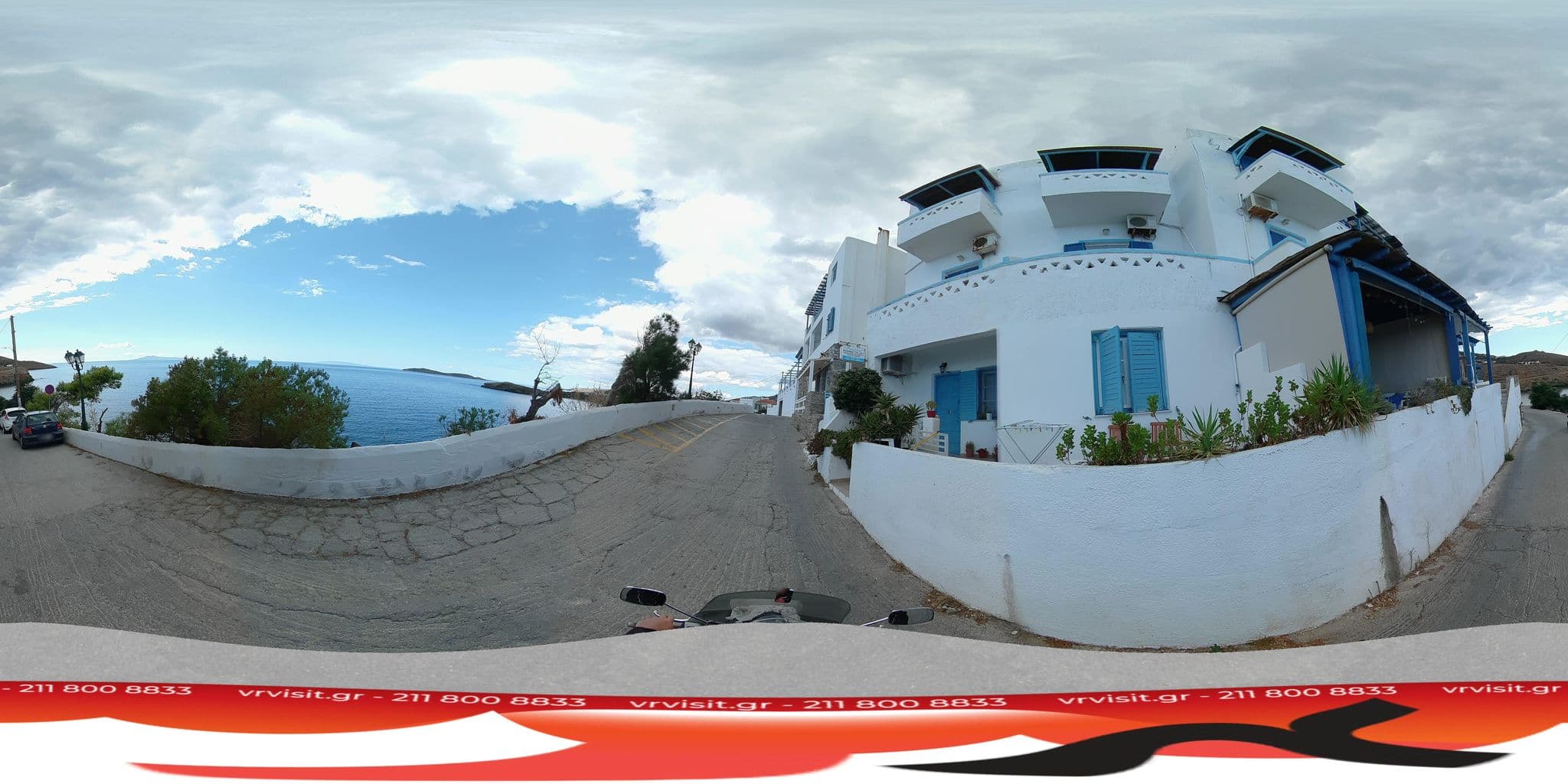 Street view near Anemos Studios Υδρούσα, Batsíon — © VRvisit (CC BY-SA · Mapillary)