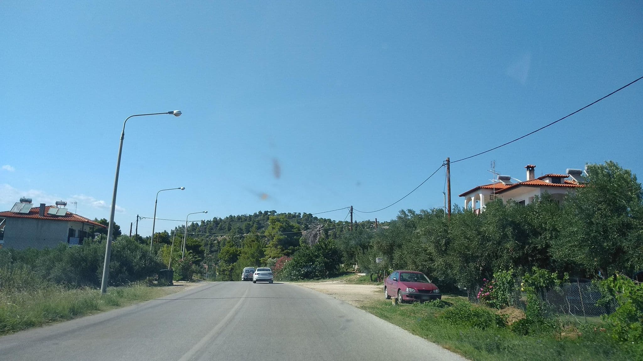 Street view near Elena's Sunset Garden Studios & Apartments, Néos Marmarás — © tavi (CC BY-SA · Mapillary)