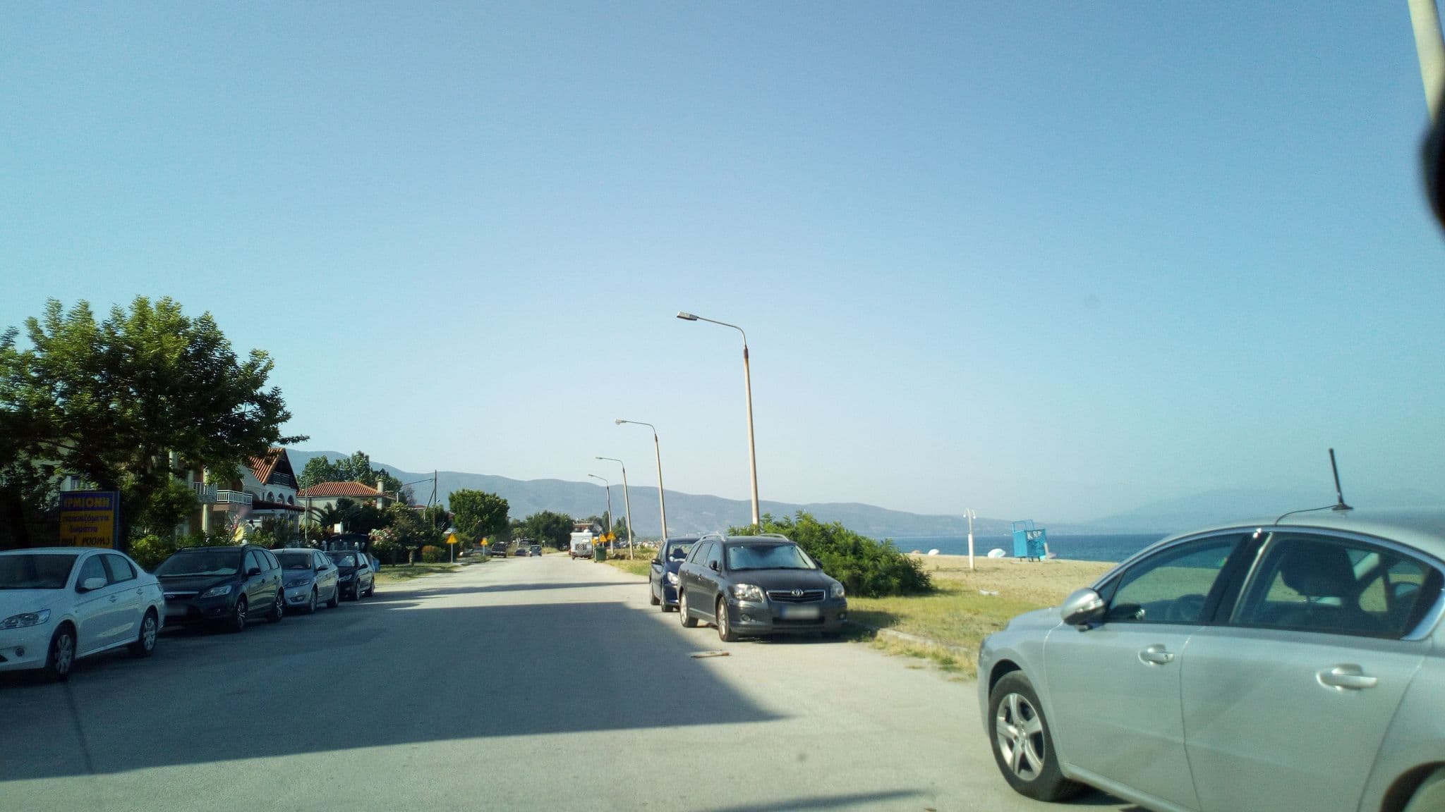 Street view near Ermioni Apartments, Néa Vrasná — © skarmoutsosv (CC BY-SA · Mapillary)