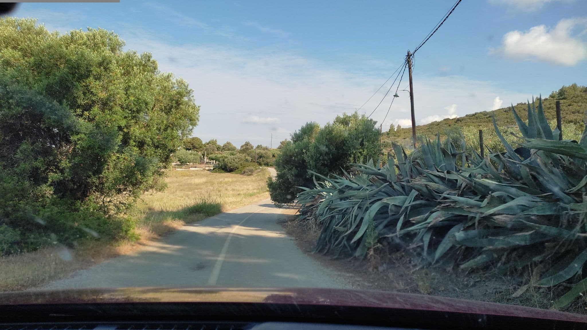 Street view near Red Coral Apartments, Ormýlia — © neau (CC BY-SA · Mapillary)