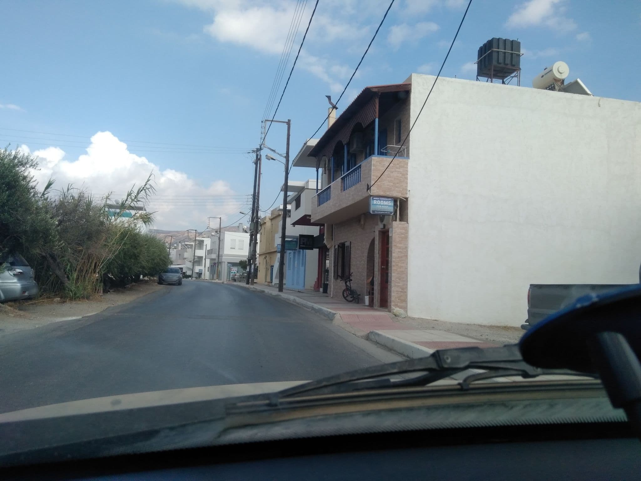 Street view near Maria Tsanakalioti's Apartments, Makry-Gialos — © marooned (CC BY-SA · Mapillary)