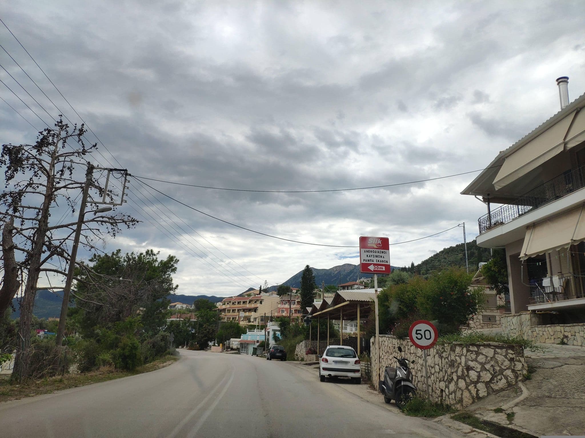 Street view near ANOGI Boutique Guesthouse 1909, Nidhríon — © pppetros (CC BY-SA · Mapillary)
