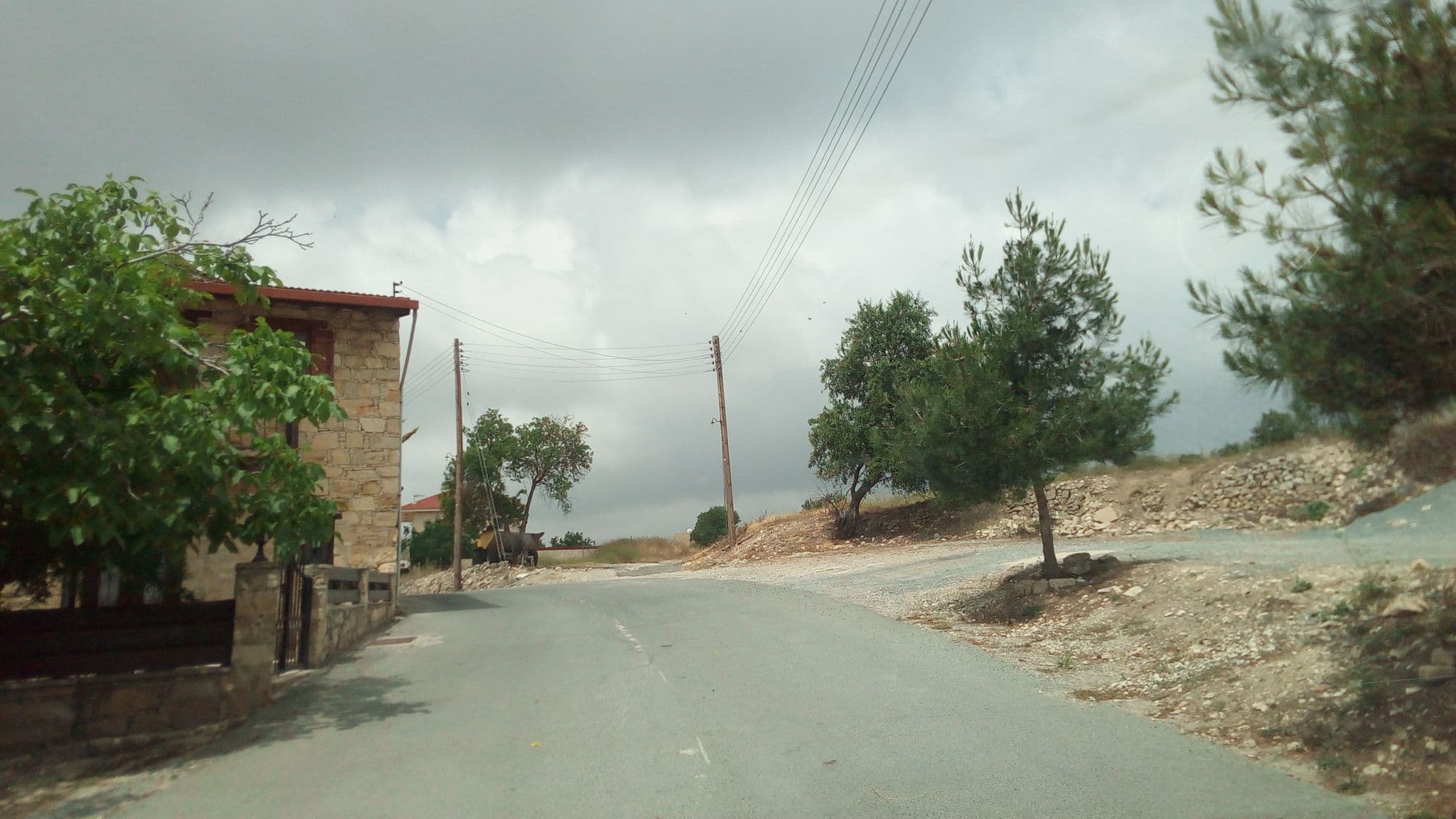 Street view near Oinoessa Traditional Boutique Guest Houses Lofou, Páchna — © stpkyriakou (CC BY-SA · Mapillary)