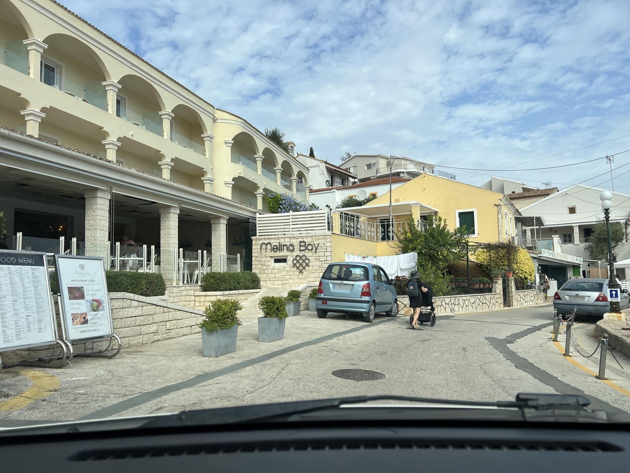 Street view near Melina Bay Boutique Hotel, Acharávi — © VMConsulting (CC BY-SA · Mapillary)