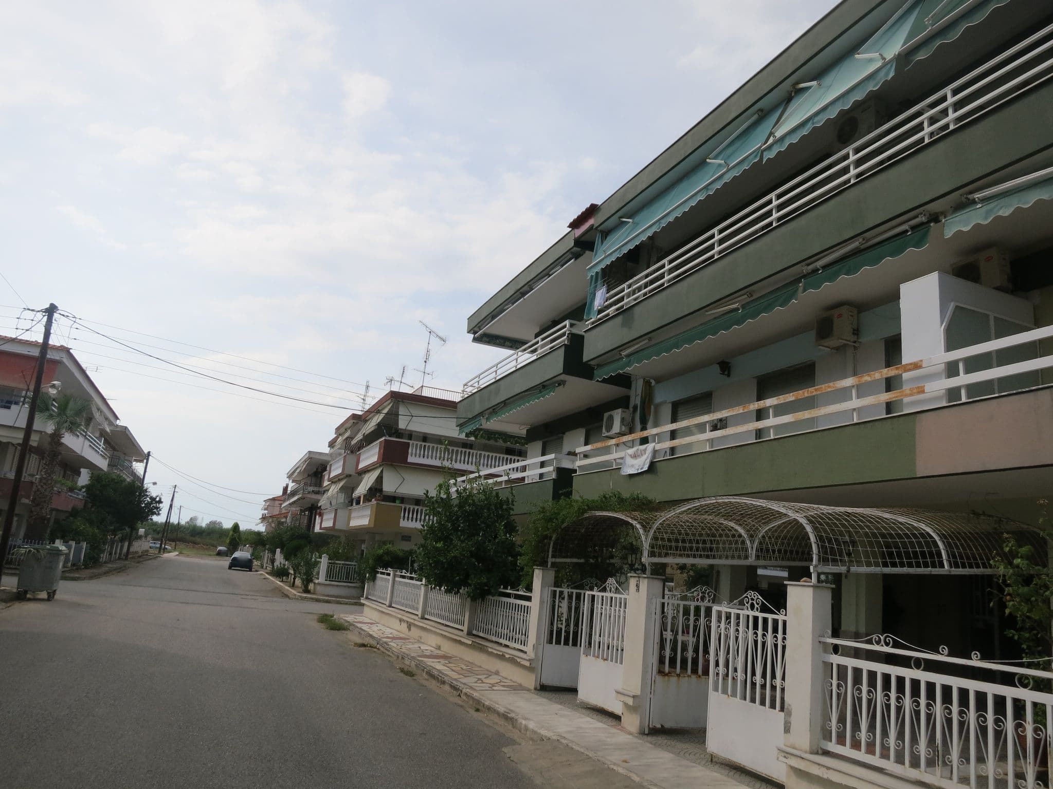 Street view near Vicky Apartments, Néa Flogitá — © zverik (CC BY-SA · Mapillary)