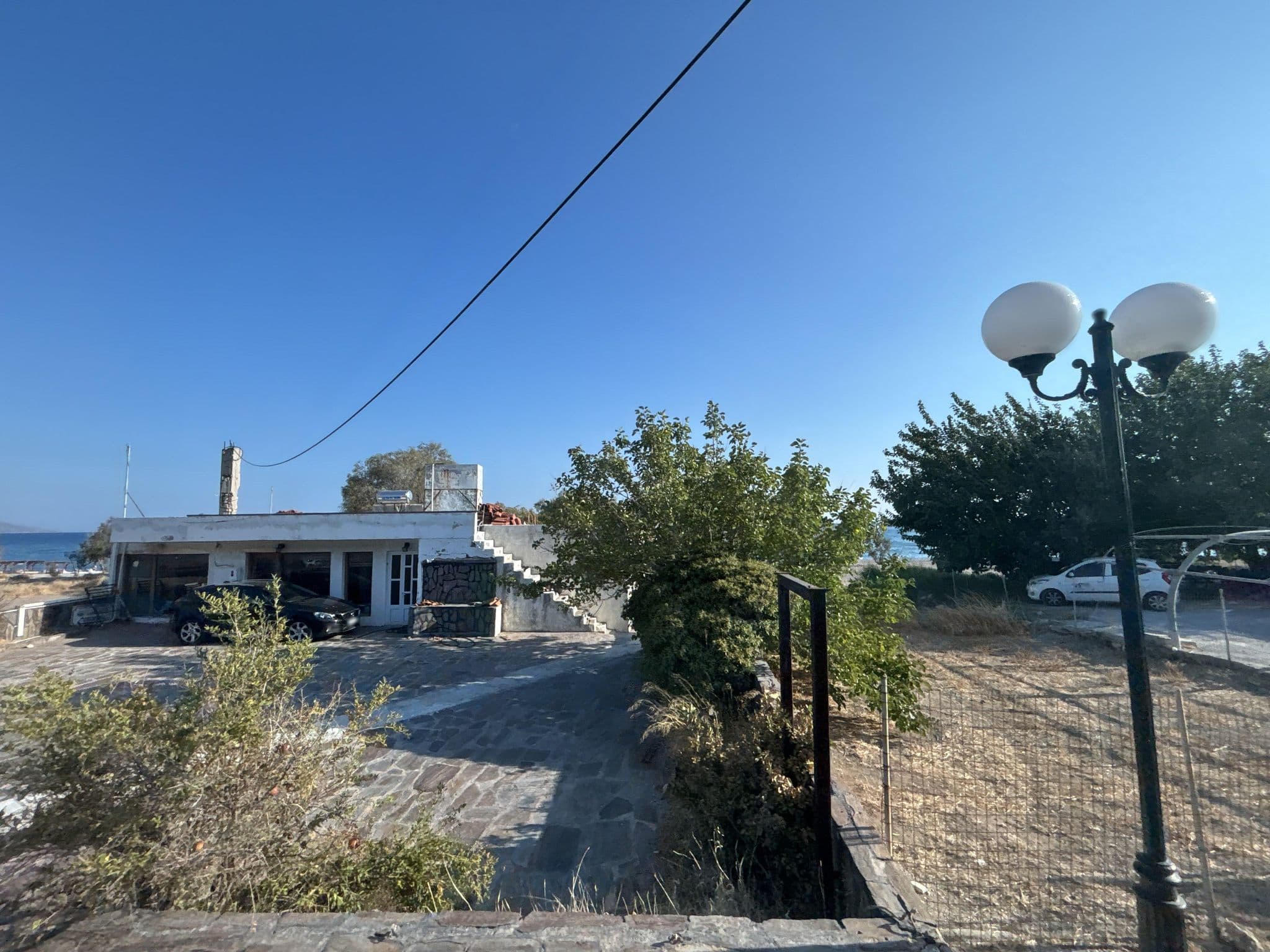 Street view near Pelagos Studios Apartments, Marathókampos — © robot8a (CC BY-SA · Mapillary)