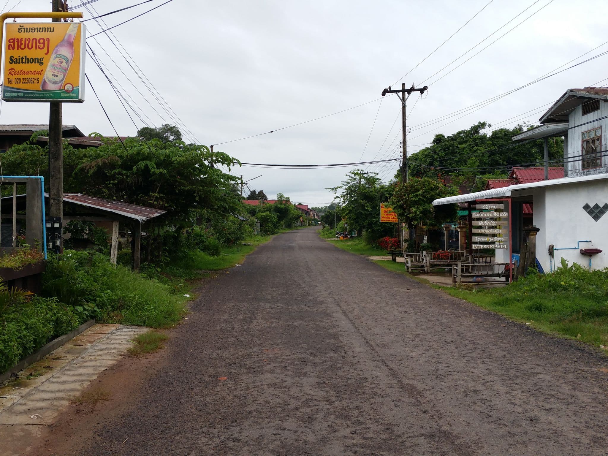 Street view near Khamphouy Guest House, Champasak — © shlublu (CC BY-SA · Mapillary)
