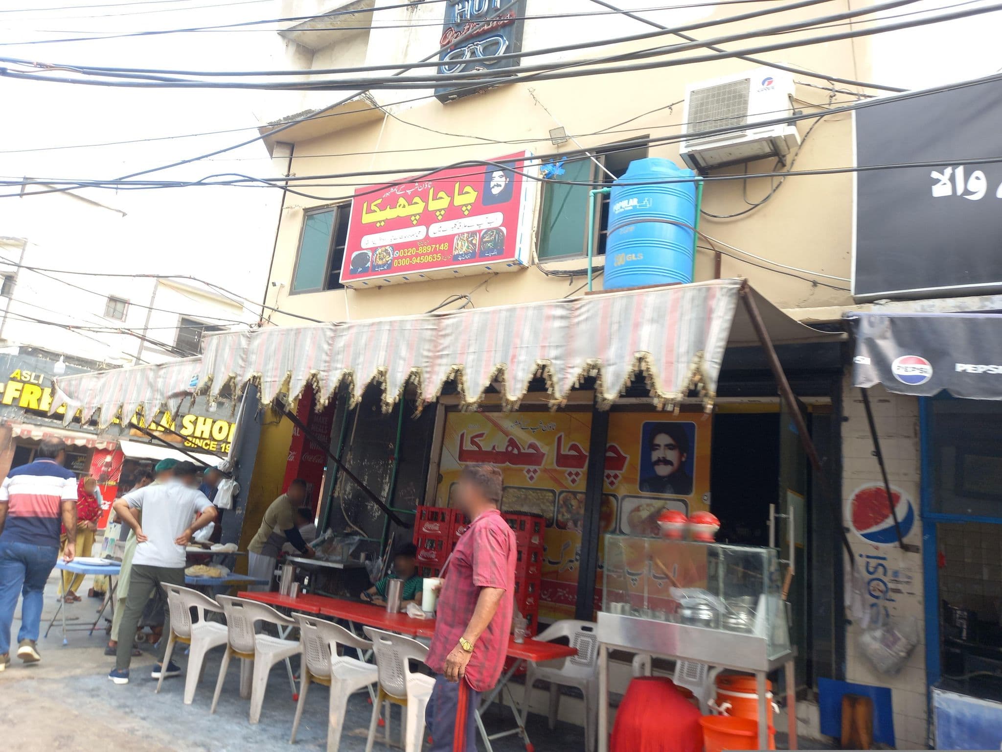 Street view near Gulberg View Hotel, Lahore — © hamzajutt (CC BY-SA · Mapillary)