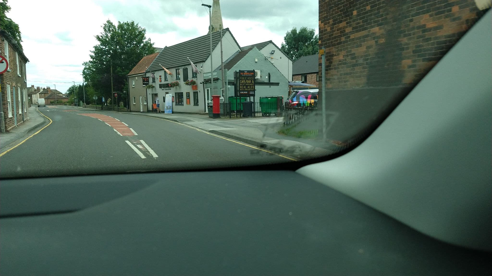 Street view near The Oddfellows Hotel Bar and grill, Camblesforth — © steverobbo (CC BY-SA · Mapillary)
