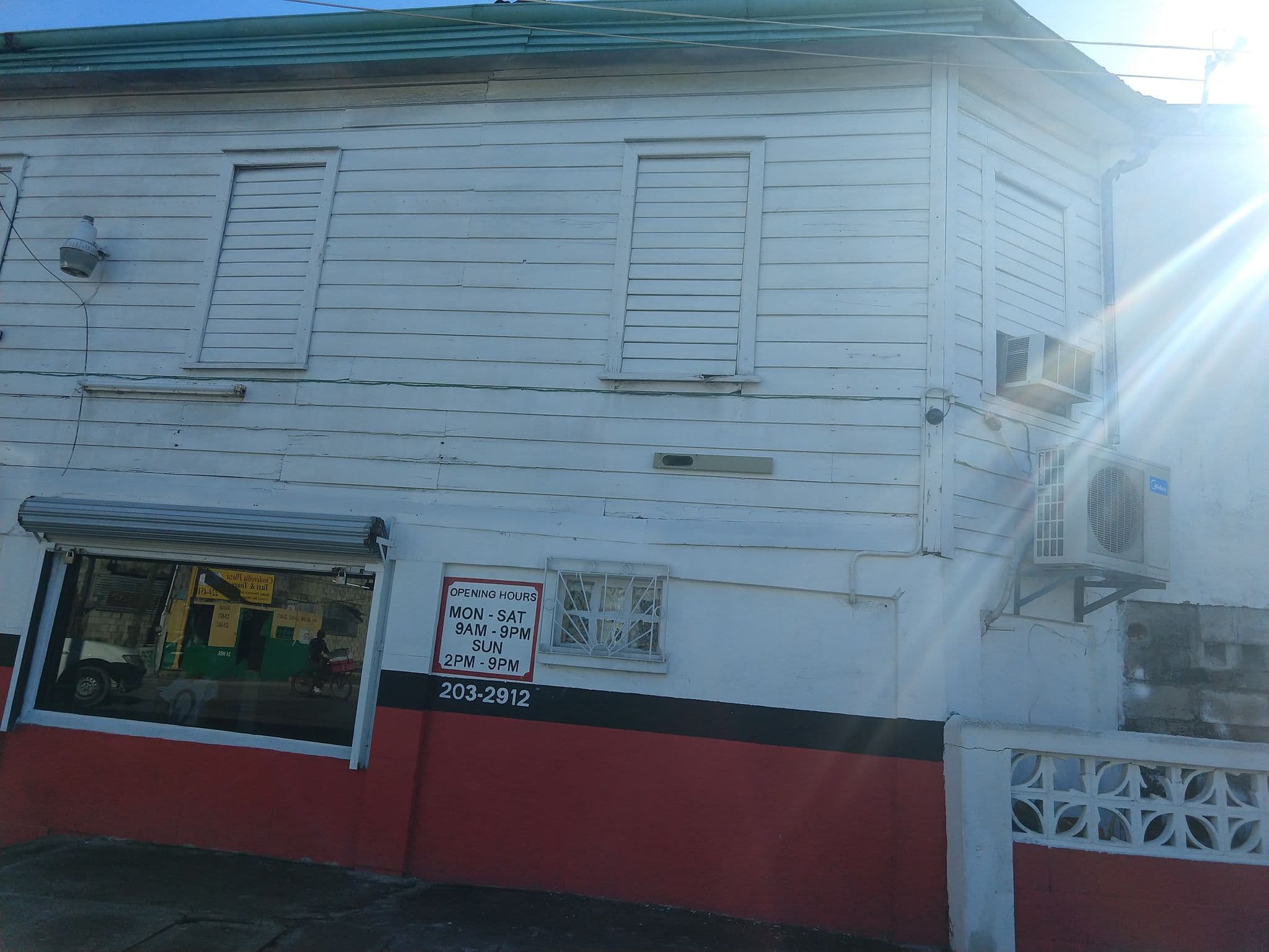 Street view near Travelart Backpackers Hostel, Belize City — © danbjoseph (CC BY-SA · Mapillary)