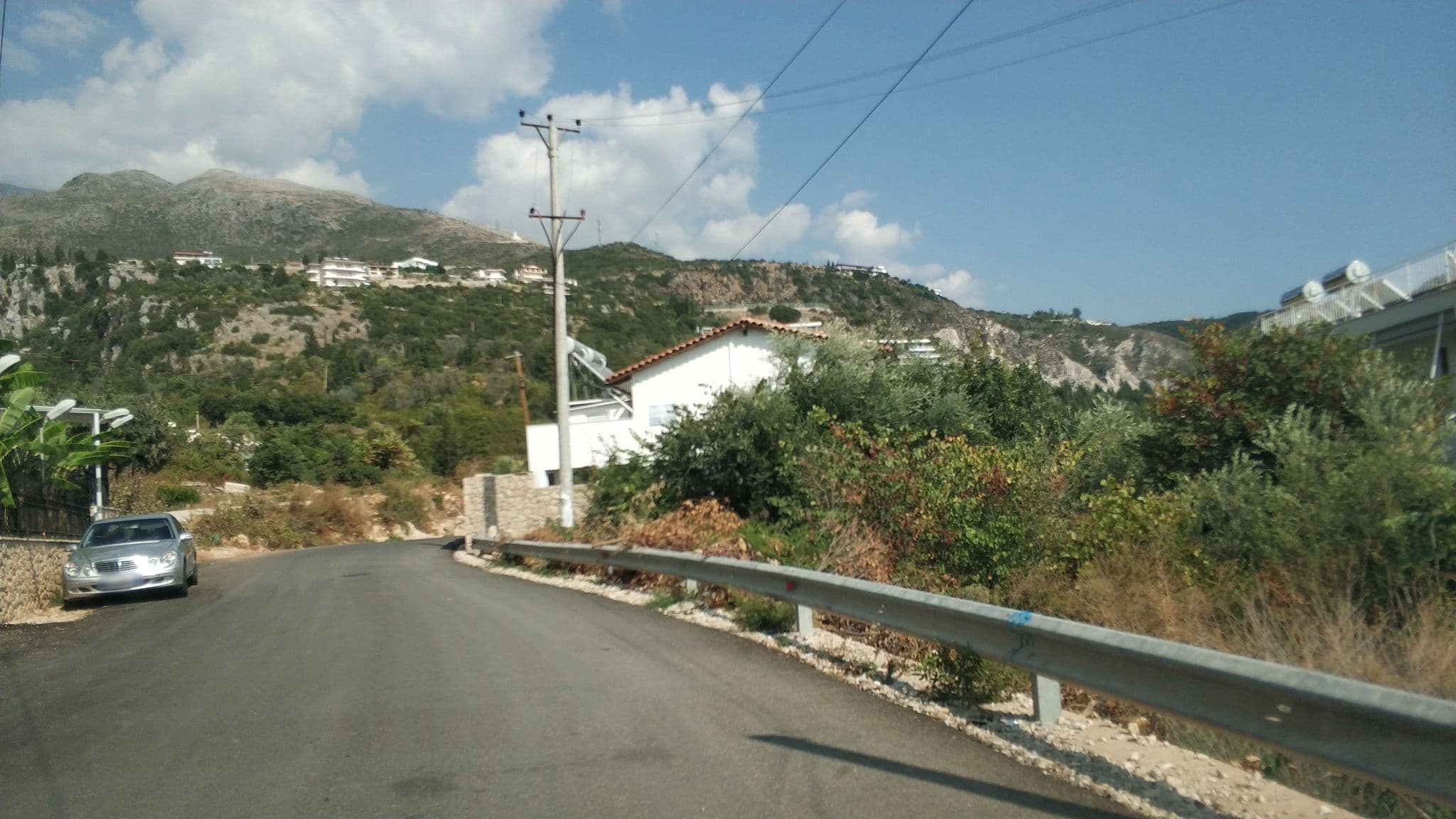 Street view near Mehilli hotel, Dhërmi — © freddouhelk (CC BY-SA · Mapillary)