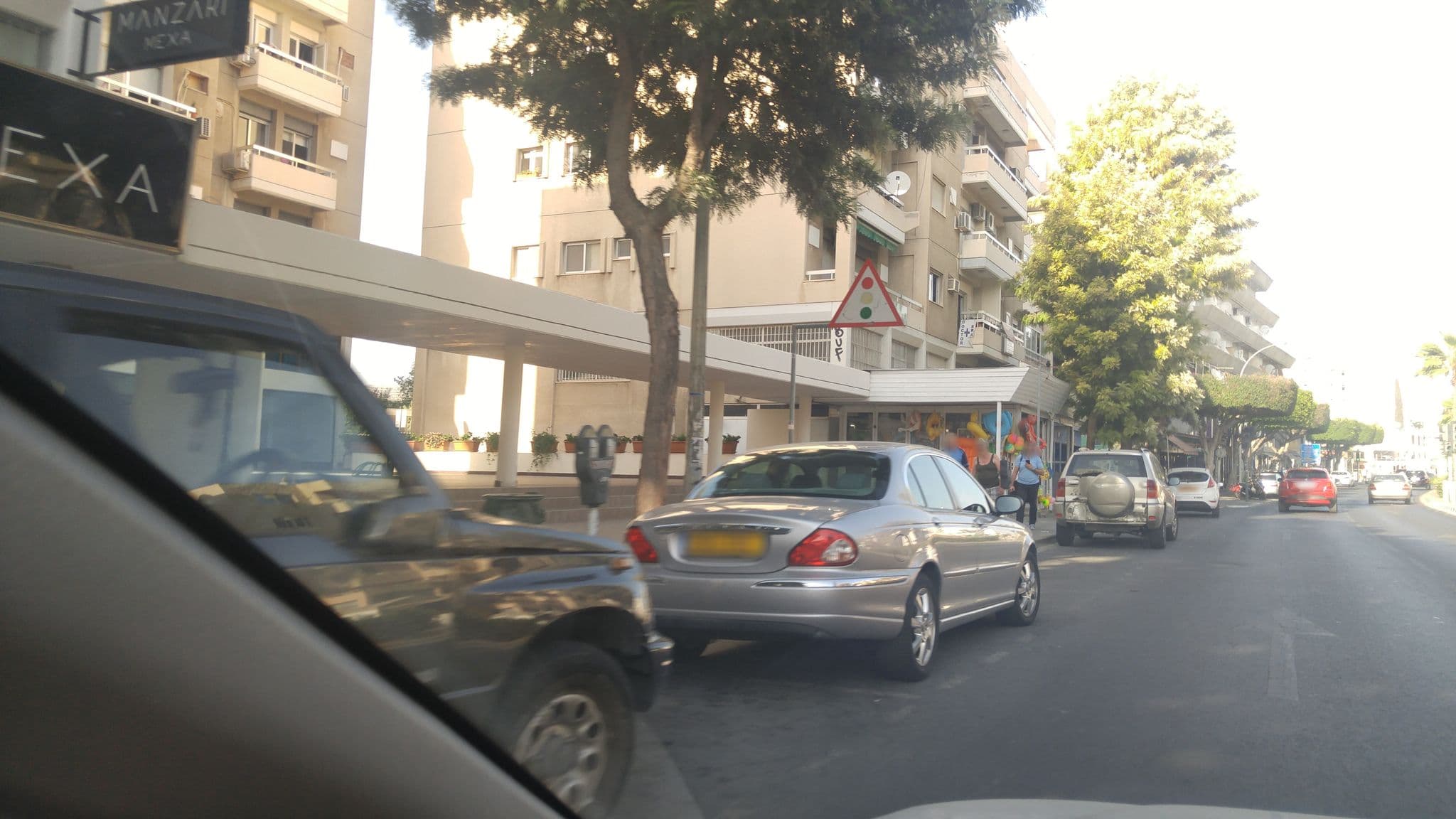 Street view near Chrystanthos Boutique Apartments, Germasógeia — © sipatsalidis (CC BY-SA · Mapillary)