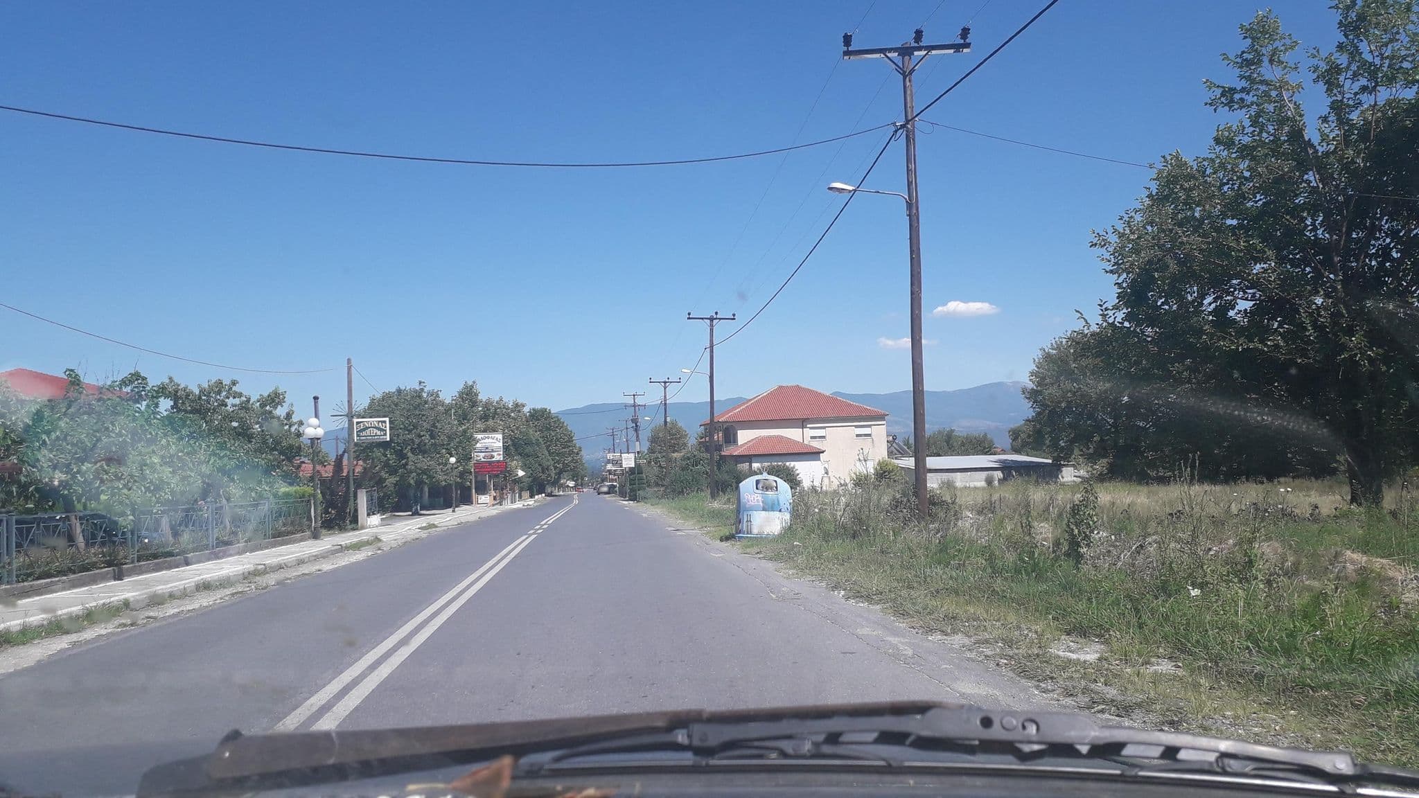 Street view near Ξενώνας Λιόγερμα, Polykárpi — © jte (CC BY-SA · Mapillary)