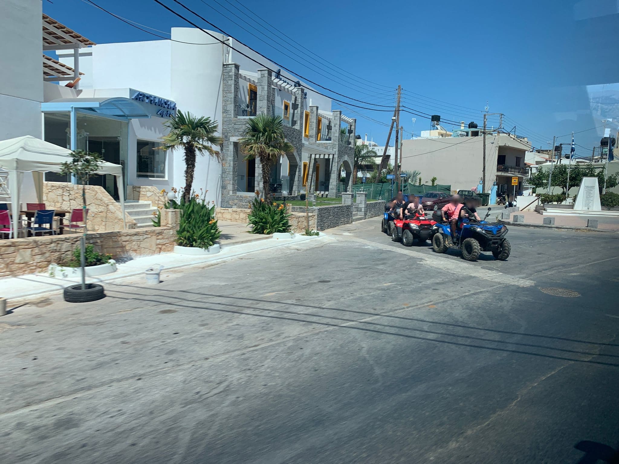 Street view near Aegean Sky Hotel & Suites, Mália — © chicc0 (CC BY-SA · Mapillary)